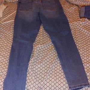 Diffierent wonen's clothing items, jeans,shirts,shoes,hats,belts,jackets,etc..